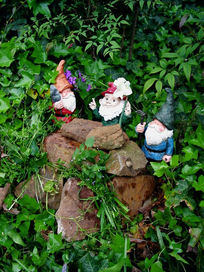Garden gnomes, such as these guarding the final resting place of Otus the Head Cat, have been known to hold a single pose for as long as eight months.
