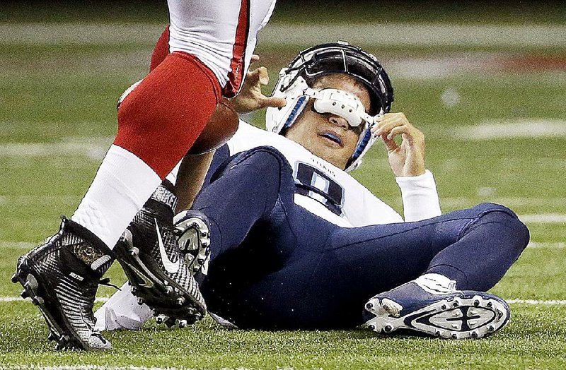 Tennessee Titans quarterback Marcus Mariota gets a rude welcome to the NFL after being sacked by Atlanta’s Tyson Jackson in the first quarter of the Falcons’ 31-24 exhibition victory. Mariota completed seven passes but threw an interception and had a fumble.