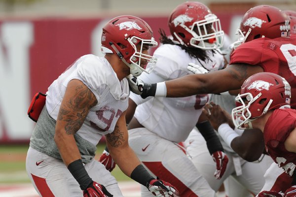 Tevin Beanum of Arkansas works through a drill during practice Saturday, April 18, 2015, at the university's practice facility in Fayetteville.