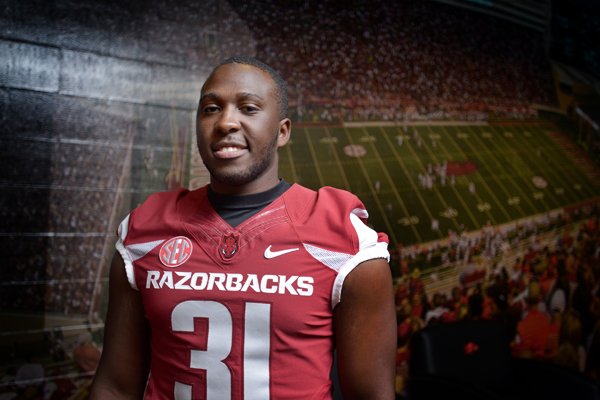 Scotty Thurman Jr. poses for a photo on Sunday, Aug. 9, 2015, during Arkansas' football media day at the Fred W. Smith Football Center in Fayetteville.