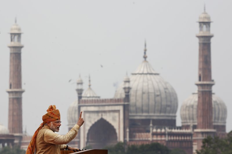 With the Jama Masjid in the background, Indian Prime Minister Narendra Modi addresses the nation on India's 69th Independence Day in New Delhi, India, Saturday, Aug. 15, 2015.