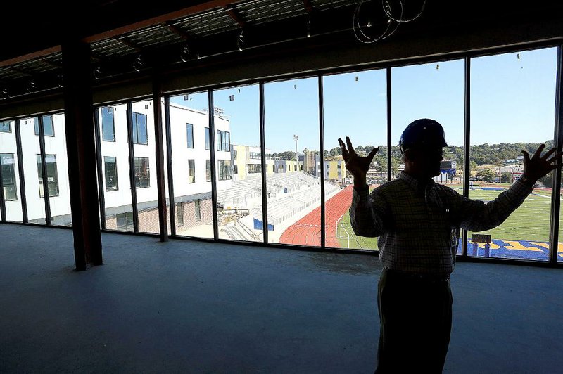 North Little Rock School District Superintendent Kelly Rodgers leads a tour of the new portions of the city’s high school Thursday. Classes at the school, parts of which are still under construction, will begin Monday.