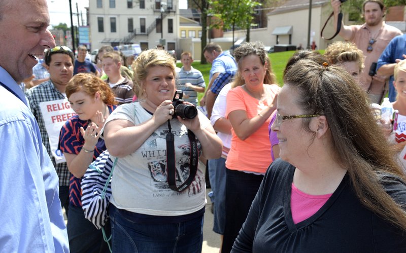 Rowan County Clerk Kim Davis, right, is greeted by supporters outside the U.S. Federal Courthouse in Covington, Ky., on Monday, July 20, 2015.