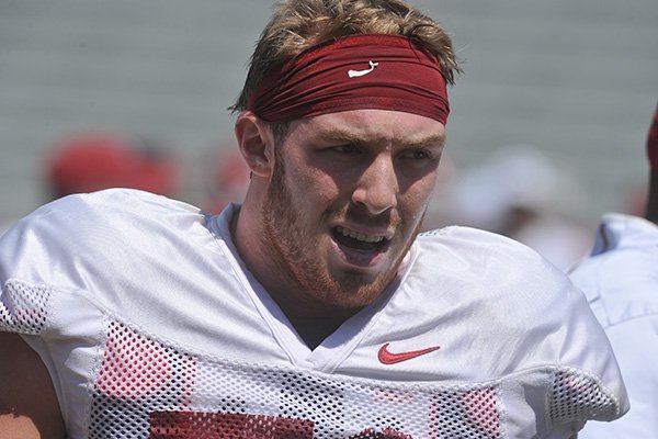 Arkansas linebacker Brooks Ellis warms up prior to practice Saturday, Aug. 15, 2015, at Razorback Stadium in Fayetteville. 