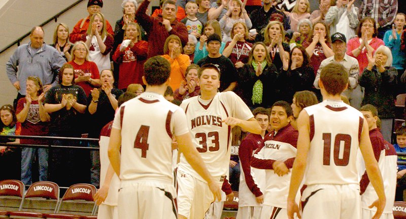 MARK HUMPHREY ENTERPRISE-LEADER The home town Lincoln crowd applauds as Shandon &#8220;Biggie&#8221; Goldman checks in for his last game at Lincoln during his junior season. The Wolves gave top-seeded Maumelle all they could handle during the 4A North Regional Basketball tournament played on March 1, 2014. The contest went into overtime with the Hornets eeking out a, 73-72, win.