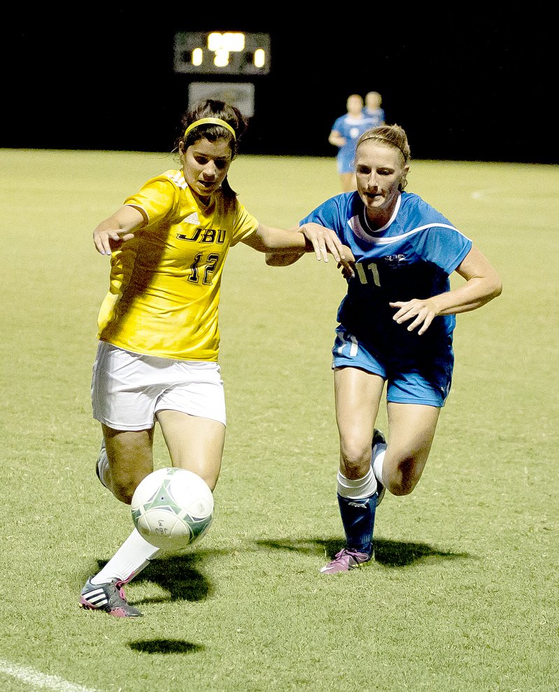 Photo courtesy of JBU Sports Information JBU midfielder Sara Frey, left, earned All-Sooner Athletic Conference First Team honors in 2014 and was named the JBU athletic department&#8217;s freshman of the year.