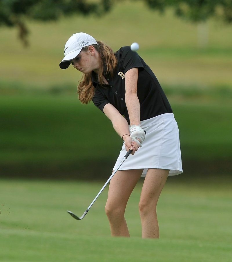 Bentonville's Kate Robertson chips onto the green during Bentonville's golf match against Har-Ber Tuesday August 18, 2015, at the Berksdale Golf Course in Bella Vista.  