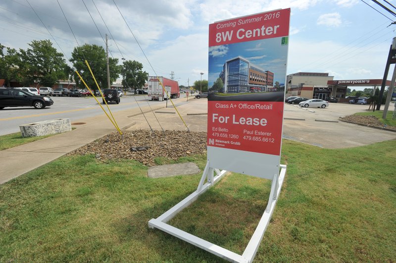 NWA Democrat-Gazette/MICHAEL WOODS &#8226; @NWAMICHAELW The proposed 8W Center project is expected to open the Summer of 2016. The 80,000-square-foot building will be at 805 S Walton Blvd. across from the Wal-Mart&#8217;s home office now has a Jimmy John&#8217;s restaurant on it.