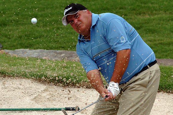 Ed Jones chips out of the sand trap on the 5th green during the second round of the Dwight Collins Chick-A-Tee Invitational at Springdale Country Club on Saturday, June 17, 2006. 
