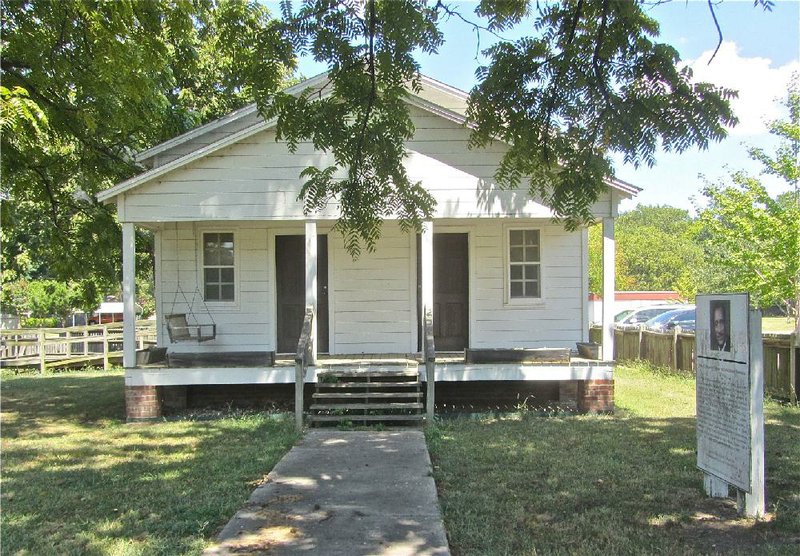 Renowned black magazine publisher John H. Johnson is honored with exhibits in a replica bungalow of his boyhood home. 