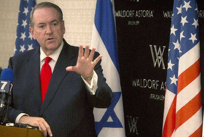 Republican presidential hopeful Mike Huckabee, speaking Wednesday in Jerusalem, raised doubts about a two-state solution for Israel and the Palestinians, and criticized the Iranian nuclear agreement, saying the “toothless, embarrassing deal poses a direct threat to Israel.” 