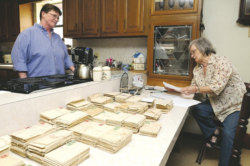 Sophia Estes, left, and Martha Estes look through more than 700 letters discovered in an old trunk at an auction. They reveal the details of a love affair but also a glimpse at life at the turn of the 20th century.
