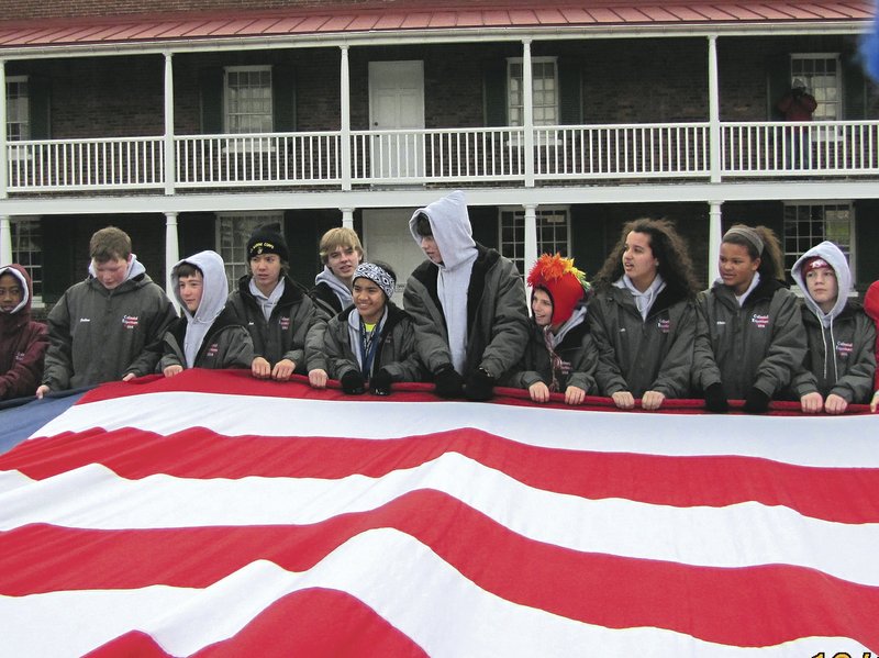 Springdale students join 164 others from the region to unfurl the Stars and Stripes at the Fort McHenry National Monument and Historic Shrine in Baltimore. The flag measures 42-by-30 feet, the same size as the garrison flag that told Francis Scott Key of the American victory on the morning of Sept. 14, 1814, and inspired him to write “The Star-Spangled Banner,” which became the National Anthem in 1931.