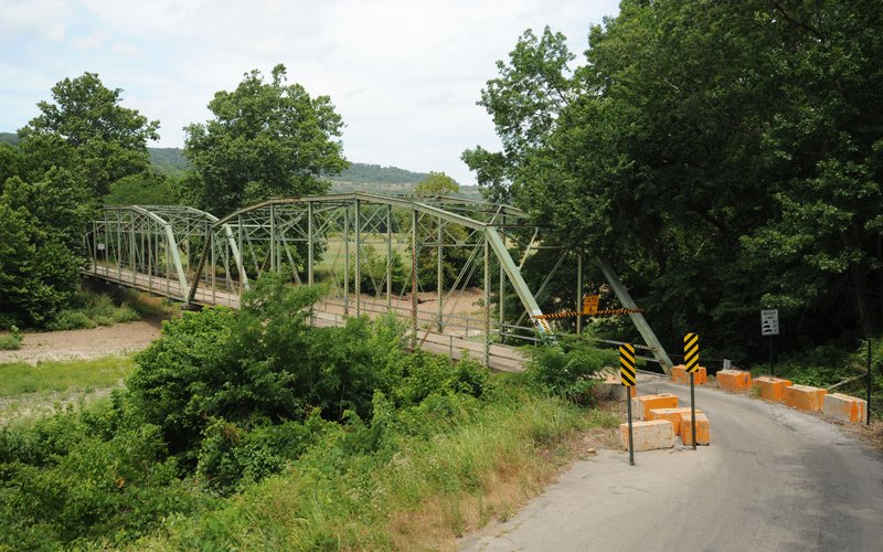 File Photo/NWA Democrat-Gazette/ANDY SHUPE Washington County and the state Highway and Transportation Department will replace the 90-year-old Woolsey Bridge, which spans the West Fork of the White River just south of West Fork. 