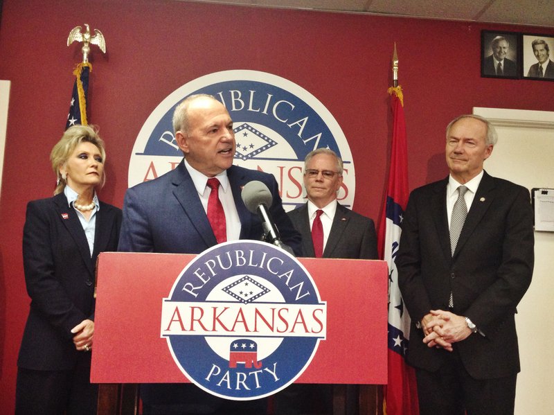 State Rep. Mike Holcomb of Pine Bluff says during a news conference Thursday, Aug. 20, 2015, that he's leaving the Democratic Party and will seek re-election as a Republican.