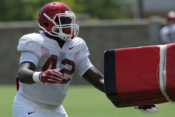 Arkansas linebacker Kendrick Jackson (42) participates in a drill Saturday, Aug. 8, 2015. during practice at the university football practice field in Fayetteville.