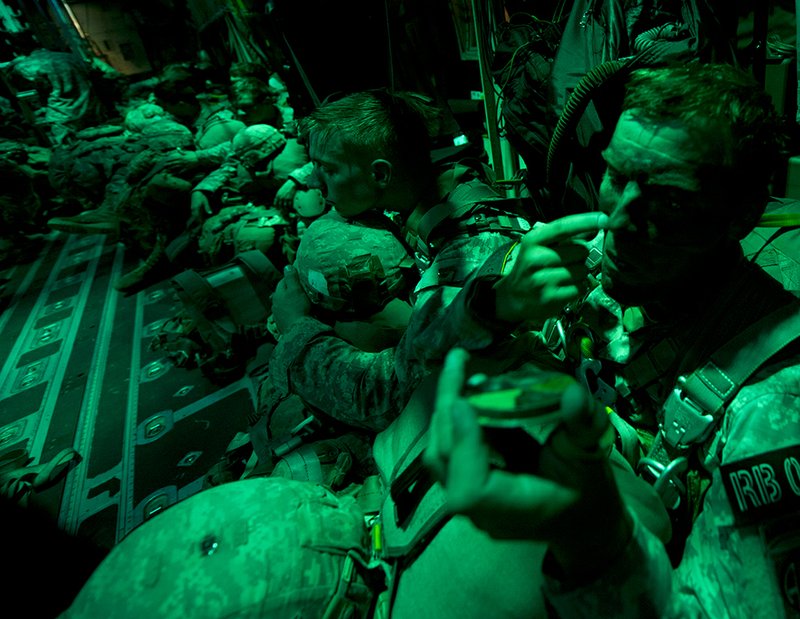 A jumpmaster from the Army’s 2nd Brigade Combat Team, 82nd Airborne Division, dons camo face paint prior to a jump Aug. 6 near the March Air Reserve Base, Calif. The 41st Airlift Squadron, along with the 61st Airlift Squadron, provided C-130J Combat Airlift for the troops and heavy equipment during Operation Dragon Spear.