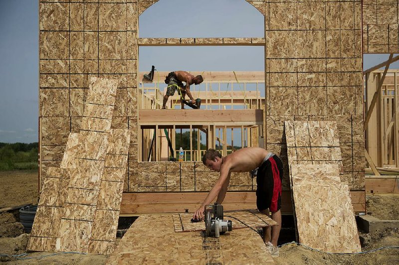 Workers install a subfloor in a new house in Peoria, Ill., earlier this month. The U.S. housing recovery’s biggest gains have been in Midwestern states, according to second-quarter data from the National Association of Realtors. 