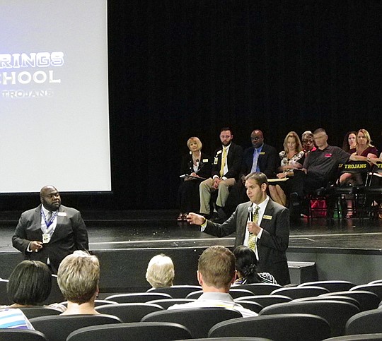 Submitted photo Hot Springs High School Principal Lloyd Jackson, left, and Superintendent Mike Hernandez explain the conversion charter process during a public hearing held Aug. 6 in the high school's Mackey Theater. District, community and other interested parties were on hand to hear the reasons for the change and the Arkansas Department of Education application requirements. The public is encouraged to be an active participant in the process.