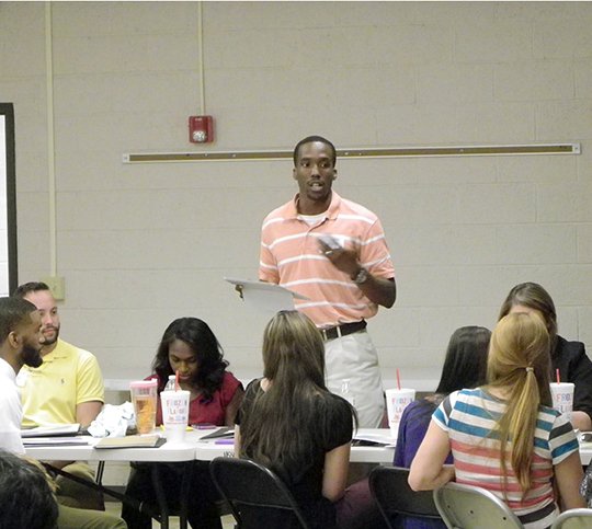 Submitted photo Hot Springs Middle School Math teacher and junior high boy's basketball coach Willie Isadore speaks during a recent training for new district staff members. Isadore is a 2009 alumni of Hot Springs High School.