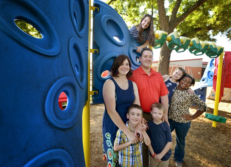 NWA Democrat-Gazette/BEN GOFF@NWABENGOFF The Meythaler family poses for a photo Thursday on the playground at Sugar Creek Elementary School in Bentonville. The family includes (front, from left) Daniel Meythaler, 5, David Meythaler, 5, (second row, from left) Ann Meythaler, Kerry Meythaler, Kylie Meythaler, 7, Charlotte Meythaler and (back) Emily Meythaler, 12. &#8220;Northwest Arkansas doesn&#8217;t do that much better than the other parts of the state in recruiting foster families. The difference is retention,&#8221; said Ann Meythaler, Benton County coordinator for The Call.