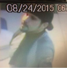 Police say this photo from surveillance shows a man who robbed a Cupid's Lingerie early Monday, Aug. 25, 2015.