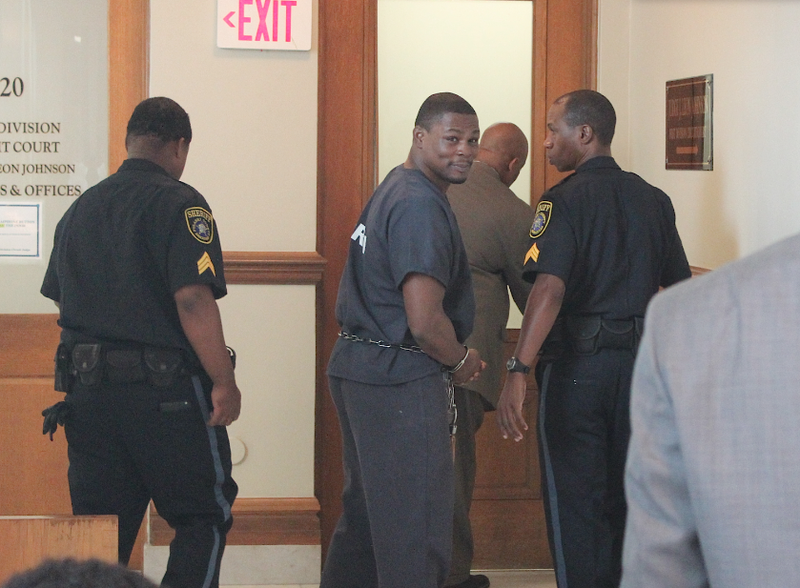 Boxer Jermain Taylor looks back at family members outside the courtroom as he's led out after a hearing Monday, Aug. 24, 2015, in Pulaski County Circuit Court.