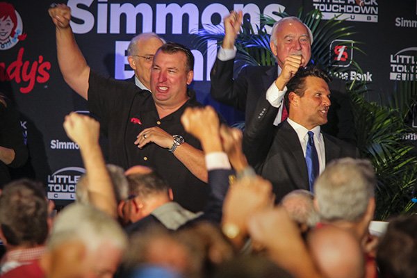 Arkansas coach Bret Bielema, left, calls the Hogs on Monday, Aug. 24, 2015, at the Little Rock Touchdown Club in Little Rock. 