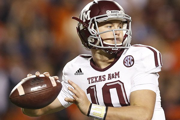 In this Nov. 8, 2014, file photo, Texas A&M quarterback Kyle Allen (10) sets back to throw the ball against Auburn during the second half of an NCAA college football game in Auburn, Ala. (AP Photo/Brynn Anderson, File)