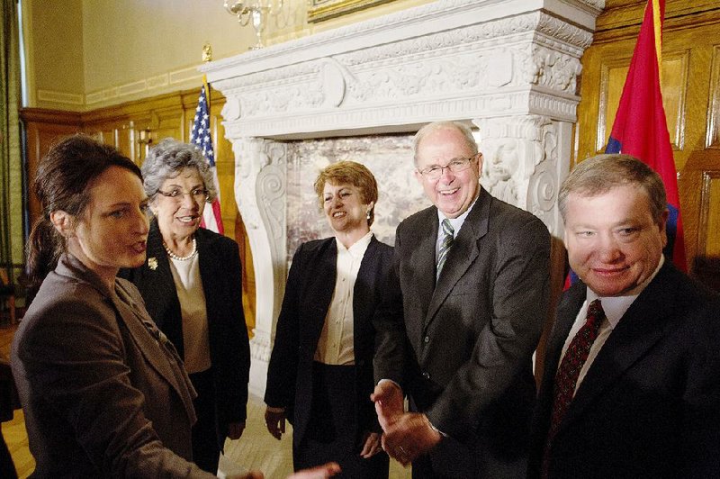 Newly appointed Arkansas Supreme Court Chief Justice Howard Brill (second from right) meets with associate justices after he was introduced Tuesday by Gov. Asa Hutchinson. From left are Justices Rhonda Wood, Josephine Hart, Karen Baker, Brill and Robin Wynne.