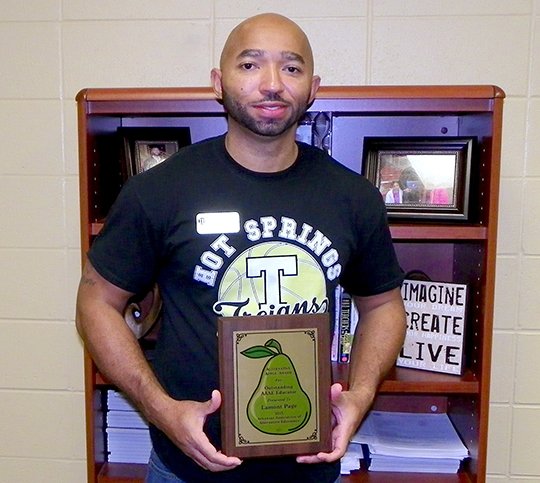 Submitted photo APPLE AWARD: Lamont Page was presented the Alternative Apple Award in July as the the Outstanding AAAE Educator of the year. Page taught social studies for two years at Hot Springs ALE Summit School and coached the Trojans'  junior high boys' basketball team. He is now the dean of students at Hot Springs Intermediate School.