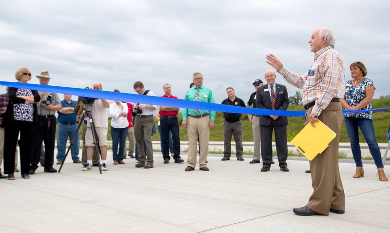 Photo by Jason Ivester Dick Trammel, Arkansas Highway Commissioner, spoke on Aug. 21, during a ribbon-cutting ceremony to mark the opening of another two-mile section of the ultimate 21-mile Bella Vista Bypass in Gravette.