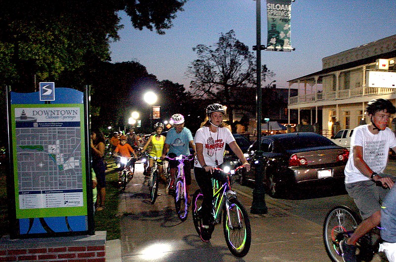 Landon Reeves/Herald-Leader Ready! Set! GO! These riders are on the way and out of the gate at the beginning of the glow ride.