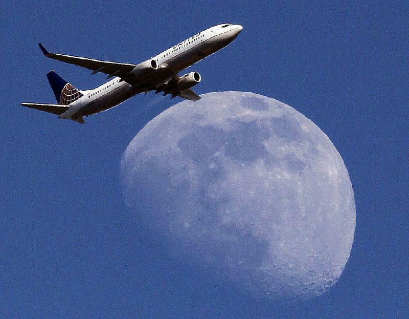 A United Airlines jet passes over Whittier, Calif., en route to Los Angeles International Airport in July. Passengers in some markets are seeing bargain airfares on some flights.