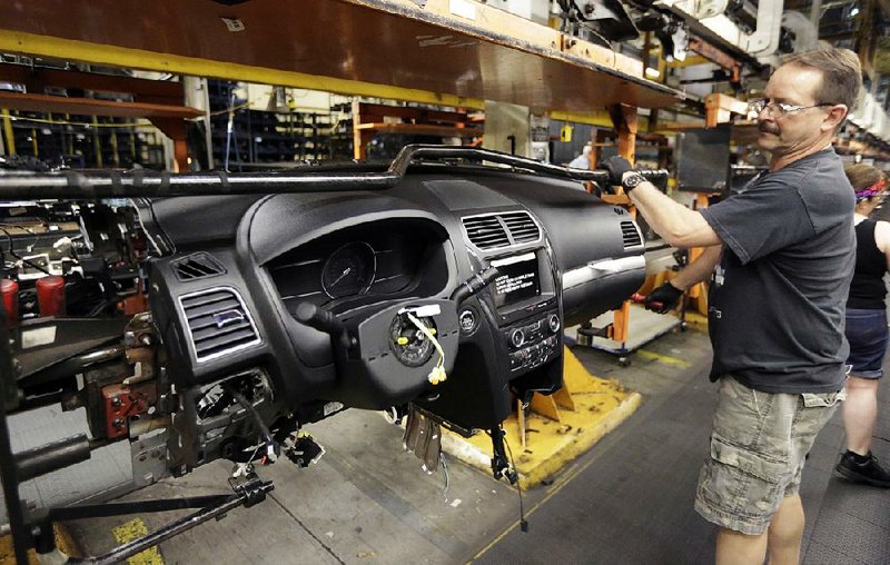 A Ford Motor Corp. employee assembles the instrument panel for a 2016 Ford Explorer at the Chicago Assembly Plant in June. Orders for durable goods rose 2 percent in July after a 4.1 percent gain in June, the Commerce Department said Wednesday.
