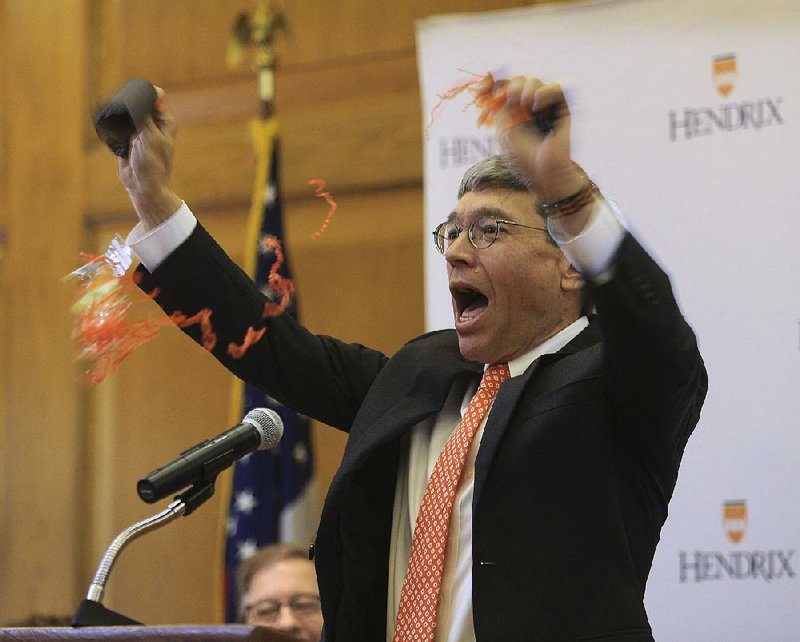 Hendrix College President Bill Tsutsui leads a celebration Wednesday after announcing the gift from the estate of Mary Ann Dawkins, the largest ever to the private institution in Conway.