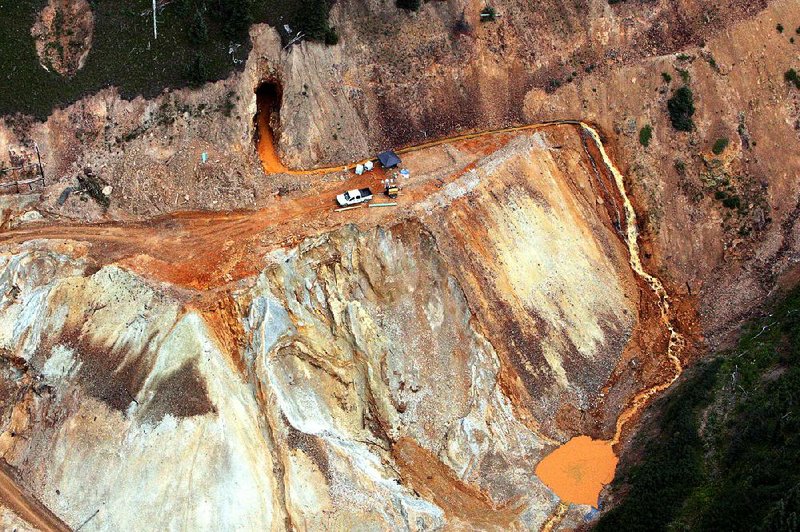 Wastewater streams out of the Gold King Mine near Silverton, Colo., on Aug. 11 after a government cleanup crew several days earlier unwittingly triggered a blowout.