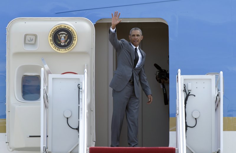 President Barack Obama waves from the top of the steps of Air Force One at Andrews Air Force Base in Md., Thursday, Aug. 27, 2015, before traveling to New Orleans for the 10th anniversary of Hurricane Katrina. Obama says New Orleans is "moving forward" a decade after Hurricane Katrina dealt it a devastating blow, and has become an example of what can happen when people rally around each other to build a better future out of the despair of tragedy. (AP Photo/Susan Walsh)
