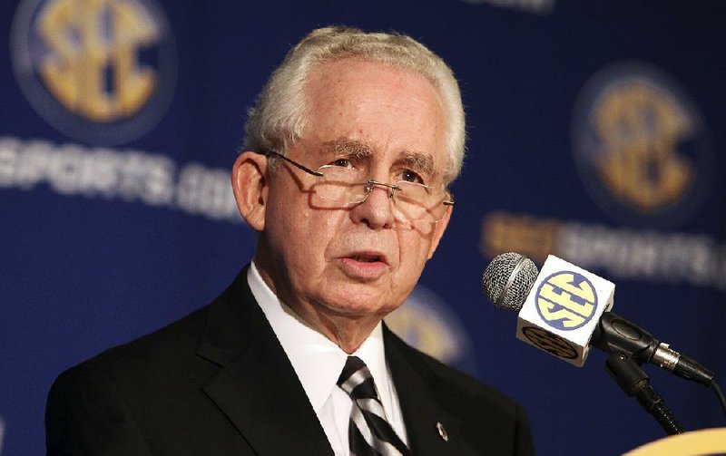 FILE - In this July 21, 2010, file photo, Southeastern Conference commissioner Mike Slive talks at a news conference during the SEC Media Days  in Hoover, Ala.   (AP Photo/ Butch Dill, File)