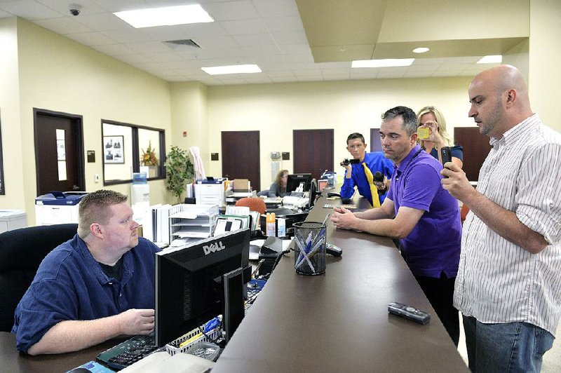 An employee in the Rowan County clerk’s office in Morehead, Ky., again turns away William Smith Jr. (right) and James Yates, who were attempting to obtain a marriage license Thursday.