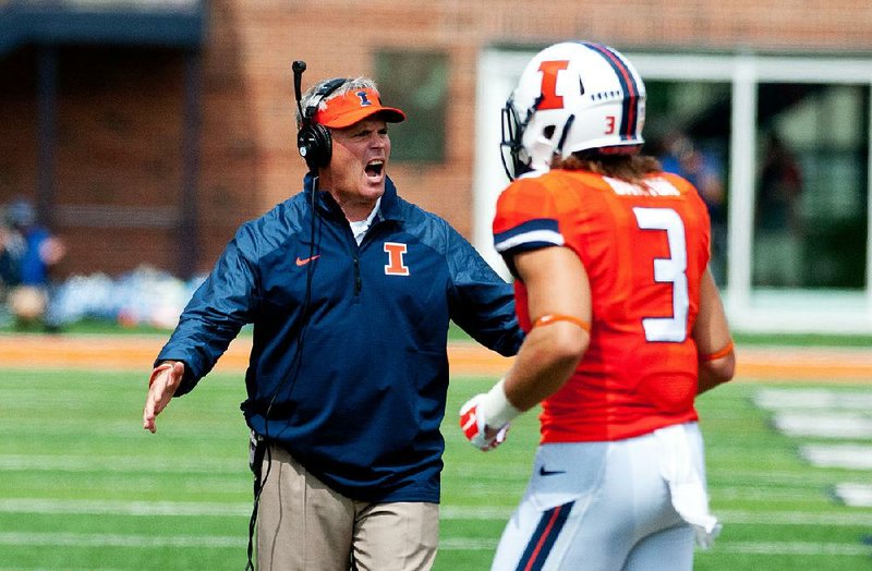 Coach Tim Beckman (left) was fired by Illinois on Friday, one week before the start of the season. The firing came after Illinois received preliminary results of an investigation into allegations of player mistreatment and inappropriate behavior.