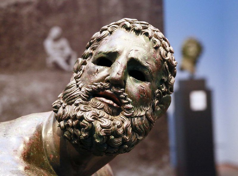 A sculpture titled "Terme Boxer, Third–Second Century B.C." is seen at the J. Paul Getty Museum in the “Power and Pathos: Bronze Sculpture of the Hellenistic World” exhibit in Los Angeles. The exhibit brings together more than 50 bronzes from the Hellenistic period that extended from about 323 to 31 B.C.