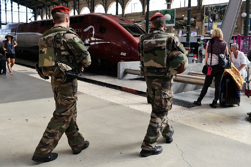 French soldiers patrol at Gare du Nord train station in Paris. Security on Europe’s rail system is the subject of talks in Paris today.