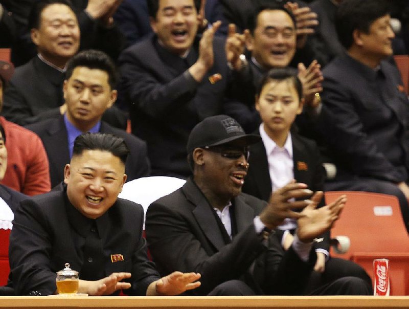 North Korean leader Kim Jong Un (left) and former NBA star Dennis Rodman watch North Korean and U.S. players in an exhibition basketball game at an arena in Pyongyang, North Korea, in this February 2013 file photo.