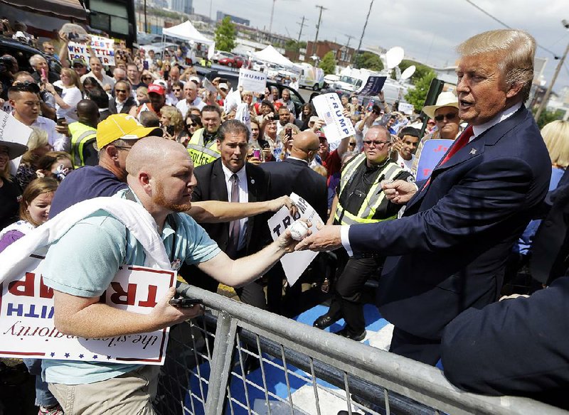 Republican presidential candidate Donald Trump, greeting supporters in Nashville on Saturday, has seen his no-holds-barred verbal style help him maintain strong poll showings.