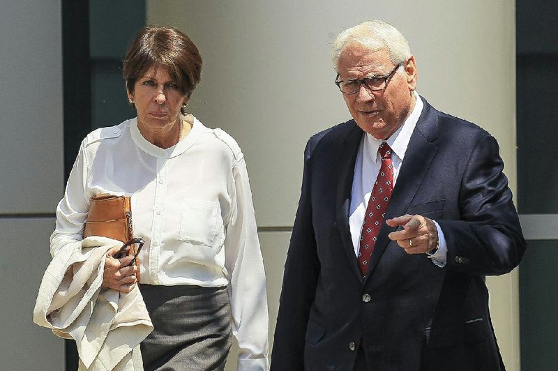 Former state Treasurer Martha Shoffner leaves the federal courthouse in Little Rock after her sentencing Friday. At right is her attorney, Chuck Banks.