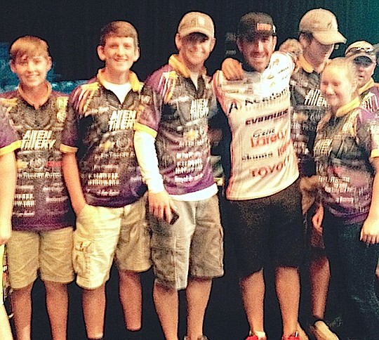 Submitted photo Students in Fountain Lake's Cobra Bass Club had the opportunity to work the weigh-in for the FLW Forrest Wood Cup in Hot Springs Aug. 20-23. The team scored a picture with tournament leader Jacob Wheeler on the opening day.