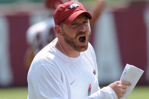 Arkansas defensive coordinator Robb Smith instructs his players Thursday, Aug. 13, 2015, during practice at the university practice field in Fayetteville.