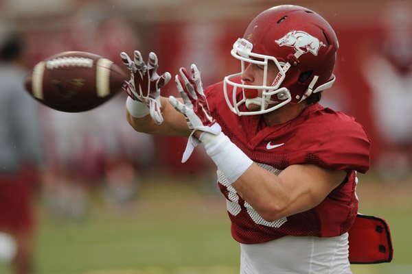 Drew Morgan of Arkansas works through a drill during practice Saturday, April 18, 2015, at the university's practice facility in Fayetteville.