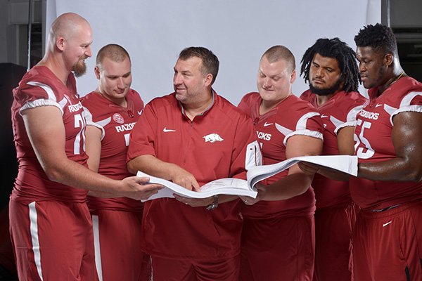 The first phase of Coach Bret Bielema’s remodeling of the Arkansas football program was making sure there was a solid foundation, and he believes he has ac- complished that with a starting offensive line of (from left) tackle Dan Skipper, guard Frank Ragnow, center Mitch Smothers, guard Sebastian Tretola and tackle Denver Kirkland. Now, in year three, he’s eager to see if the Razorbacks have enough other pieces in place to be a contender in the SEC West.